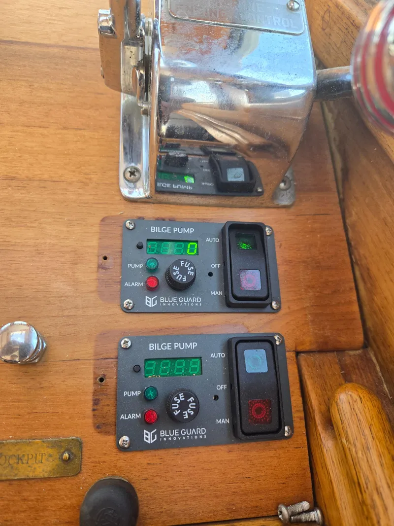 Slide: The Image of Control panel of a 1980 Shannon 38 PH boat with bilge pump switches. - 18