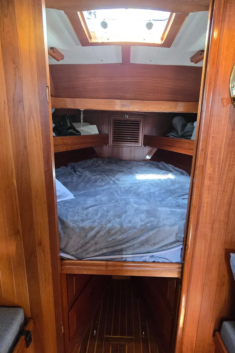 Slide: The Image of Cozy cabin interior of 1980 Shannon 38 PH sailboat with wooden finish and skylight. - 21