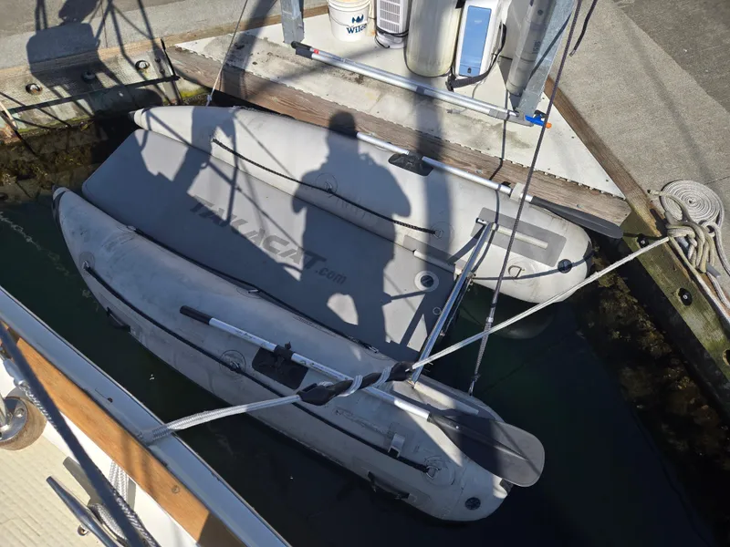 Slide: The Image of Shadow on docked inflatable boat near Shannon 38 PH, 1980 model. - 23