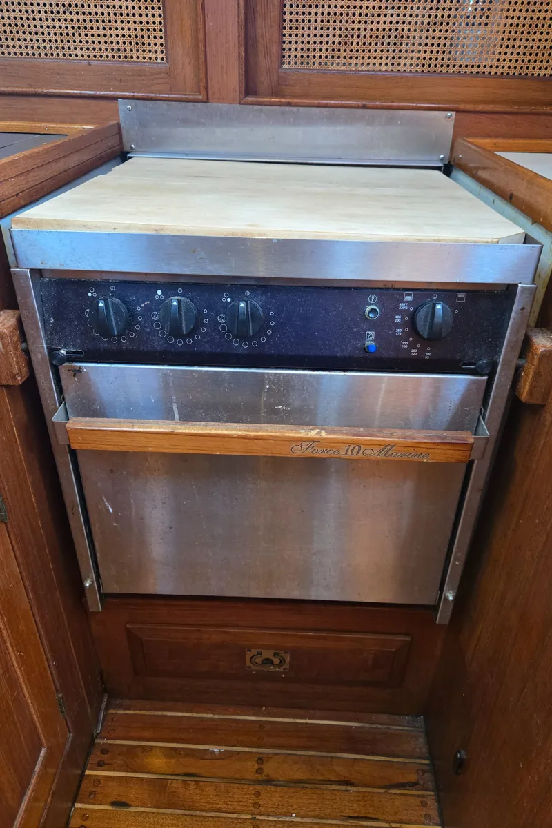Slide: The Image of Stainless steel oven in a 1980 Shannon 38 PH boat kitchen. - 24