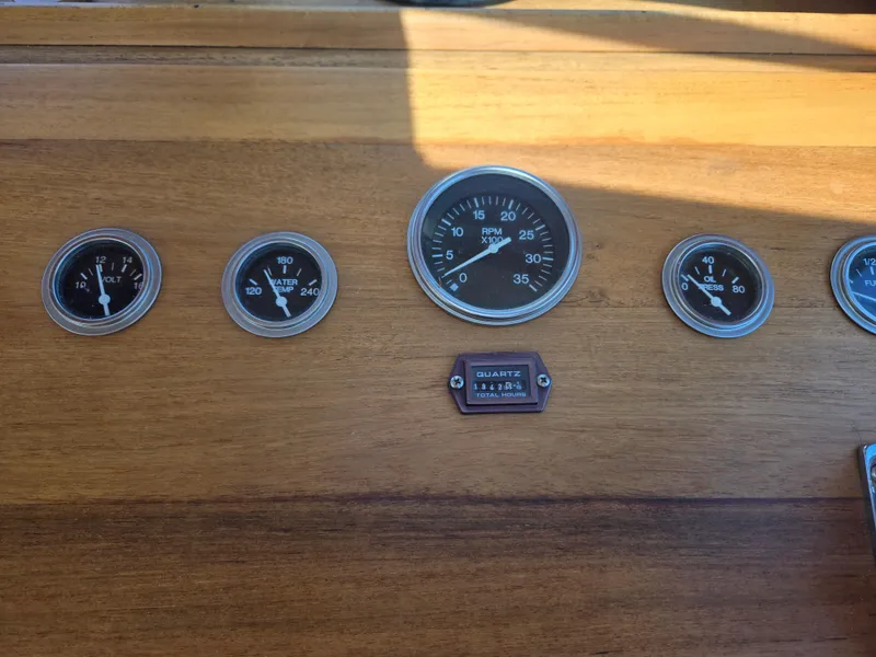 Slide: The Image of Dashboard of a 1980 Shannon 38 PH boat with various gauges and dials. - 29