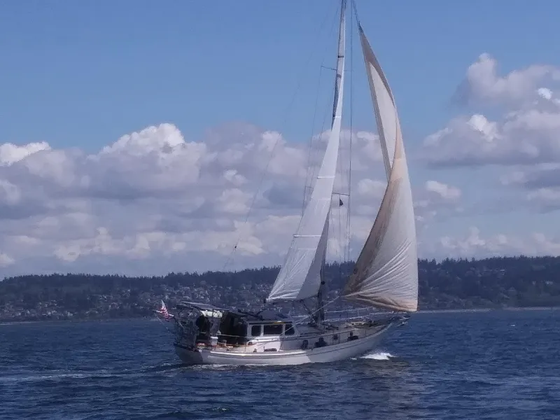 Slide: The Image of Sailboat Shannon 38 PH 1980 cruising on a sunny day with scenic background. - 31