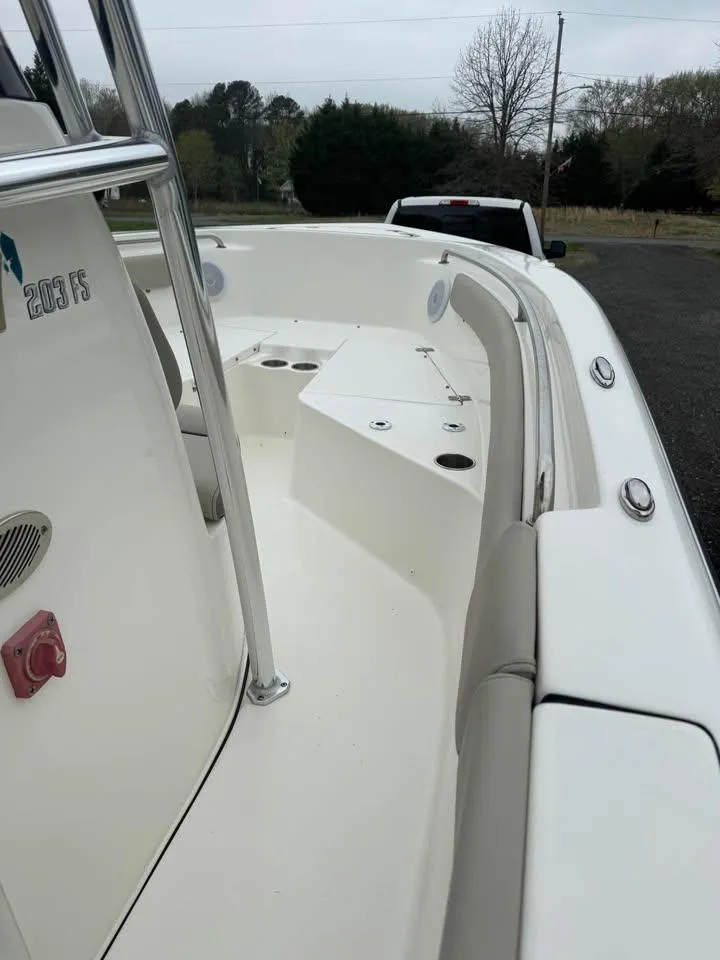 Slide: The Image of 2023 Key West 203 FS boat interior with seating and storage compartments. - 11