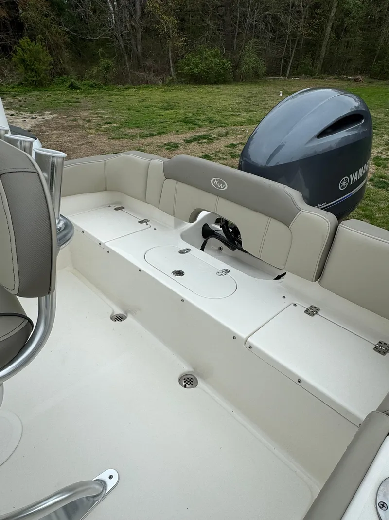 Slide: The Image of 2023 Key West 203 FS boat interior with Yamaha engine, outdoor setting. - 14