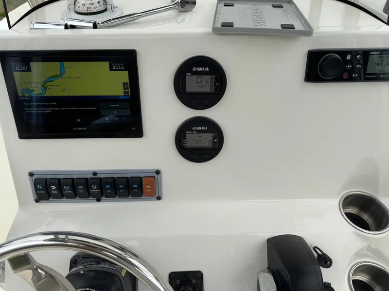 Slide: The Image of 2023 Key West 203 FS boat dashboard with navigation screen and controls. - 7