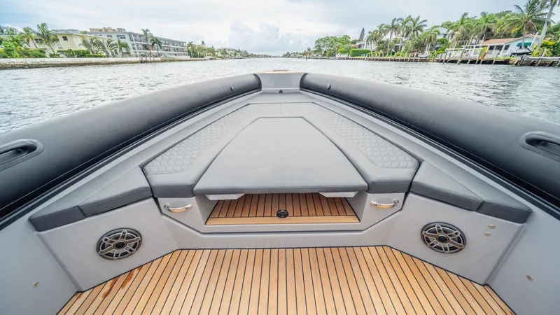 Slide: The Image of Luxury Skipper-BSK 38 boat interior, 2025 model, featuring sleek seating and premium wood flooring. - 13
