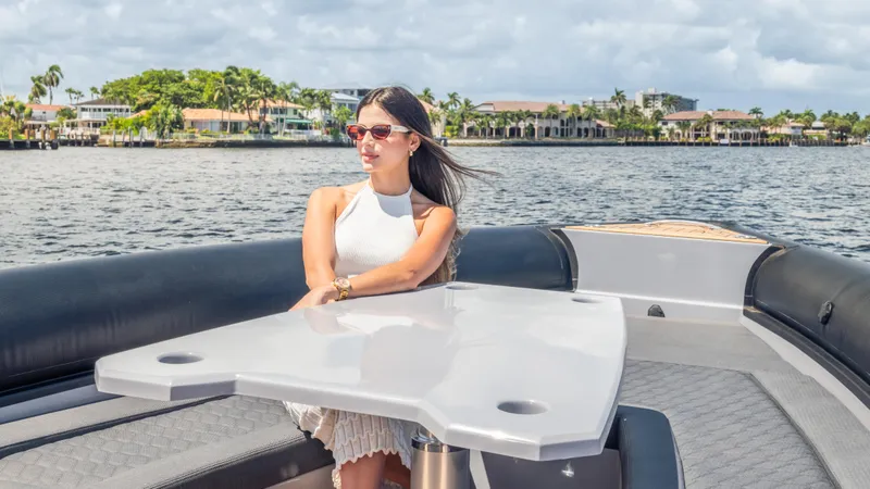 Slide: The Image of Woman relaxing on Skipper-BSK 38 yacht, 2025 model, enjoying a sunny day on the water. - 22