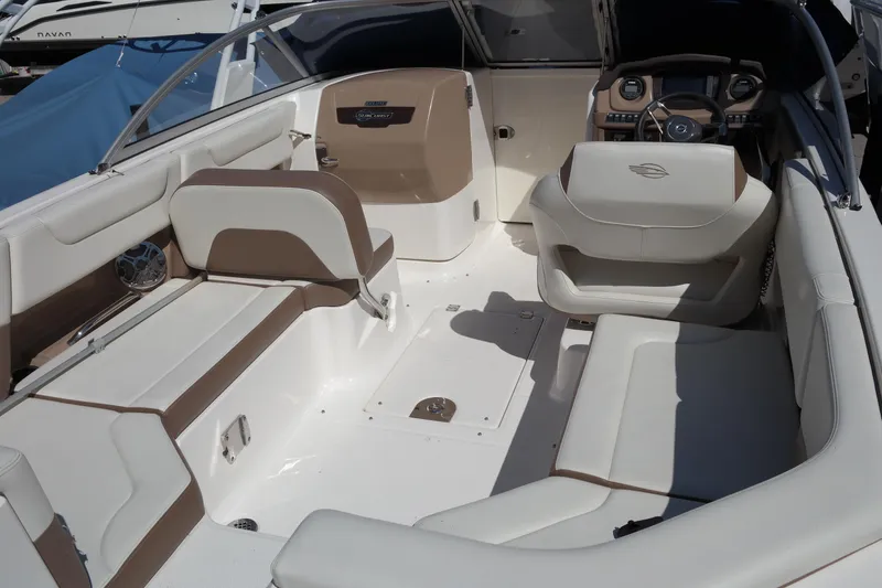 Slide: The Image of 2015 Chaparral 250 Suncoast boat interior with beige and white seating. - 20