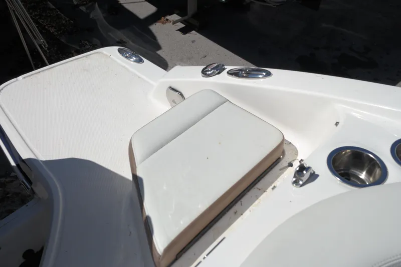 Slide: The Image of 2015 Chaparral 250 Suncoast boat deck with seating and cup holders. - 23