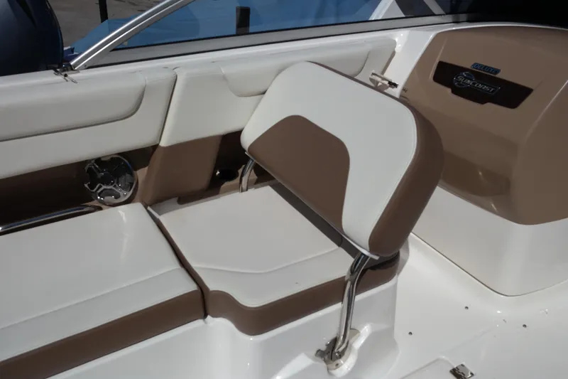 Slide: The Image of 2015 Chaparral 250 Suncoast boat interior with brown and white seating. - 26