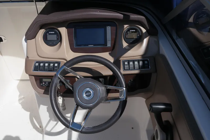Slide: The Image of Steering wheel and dashboard of 2015 Chaparral 250 Suncoast boat. - 34