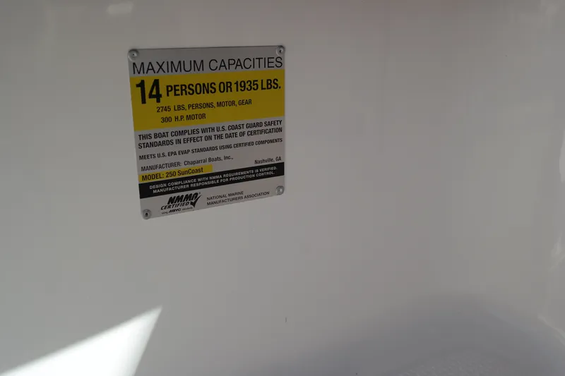 Slide: The Image of Capacity label on 2015 Chaparral 250 Suncoast, maximum 14 persons or 1935 lbs. - 6