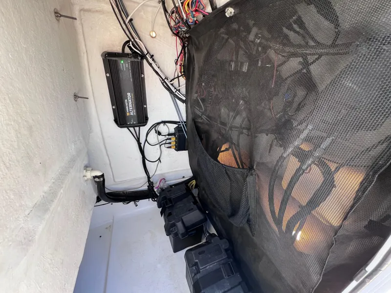 Slide: The Image of 2016 Sportsman Masters 227 Bay Boat interior wiring and battery setup. - 15