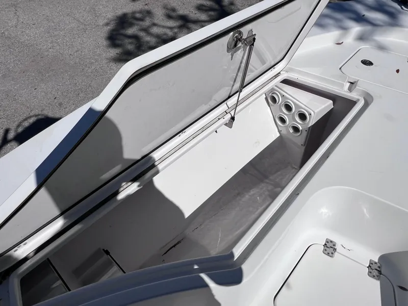 Slide: The Image of Open storage compartment on a 2016 Sportsman Masters 227 Bay Boat. - 17