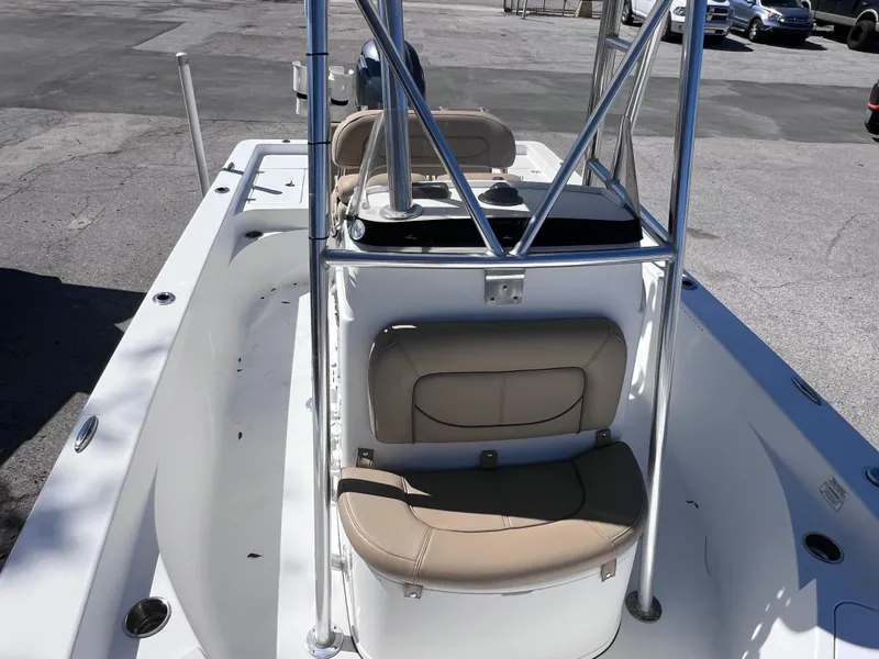 Slide: The Image of 2016 Sportsman Masters 227 Bay Boat interior with seating and console. - 19