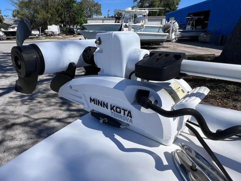 Slide: The Image of Minn Kota Terrova trolling motor on 2016 Sportsman Masters 227 Bay Boat, docked outdoors. - 21