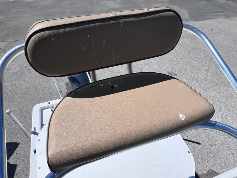Slide: The Image of Brown seat on 2016 Sportsman Masters 227 Bay Boat, showing minor wear. - 23