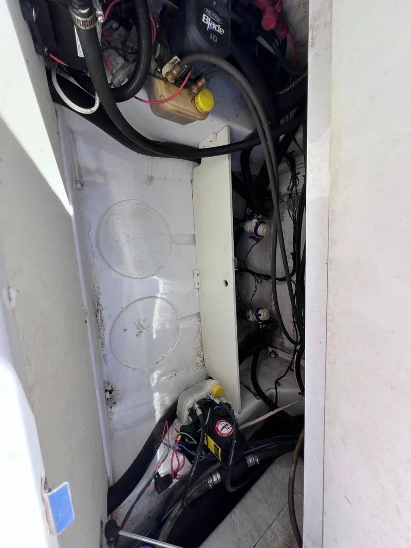 Slide: The Image of 2016 Sportsman Masters 227 Bay Boat interior wiring and battery compartment. - 27