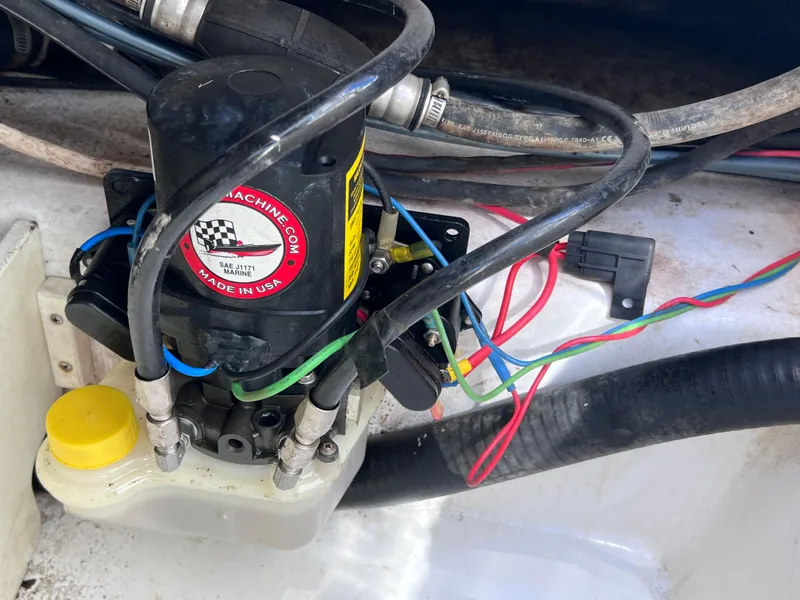 Slide: The Image of 2016 Sportsman Masters 227 Bay Boat hydraulic system with wiring and fluid reservoir. - 29