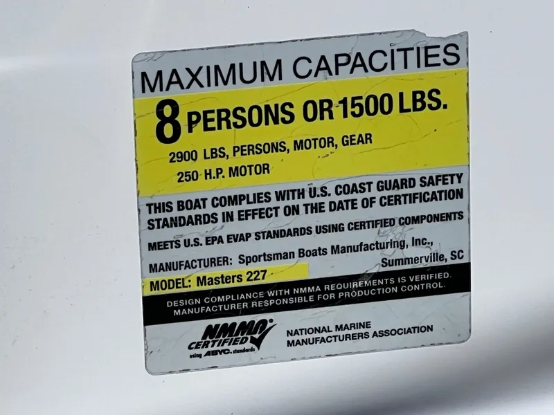 Slide: The Image of 2016 Sportsman Masters 227 Bay Boat capacity label, 8 persons or 1500 lbs, 250 HP motor. - 30