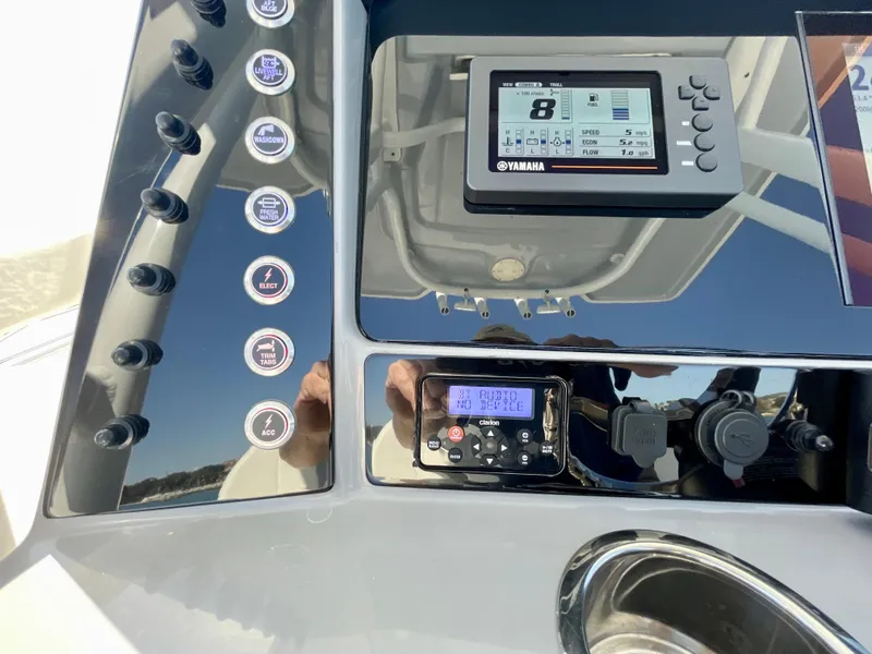 Slide: The Image of 2022 Robalo R230 Center Console dashboard with Yamaha display and control panel. - 21