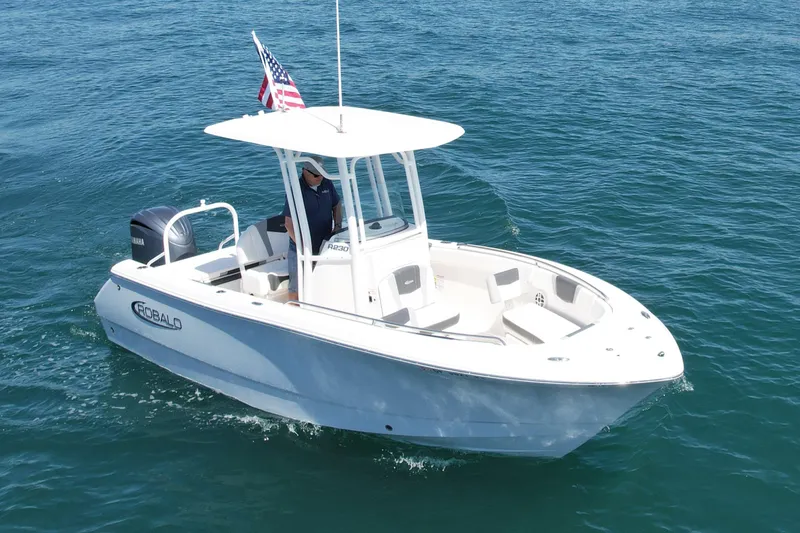Slide: The Image of 2022 Robalo R230 Center Console boat cruising on open water. - 4
