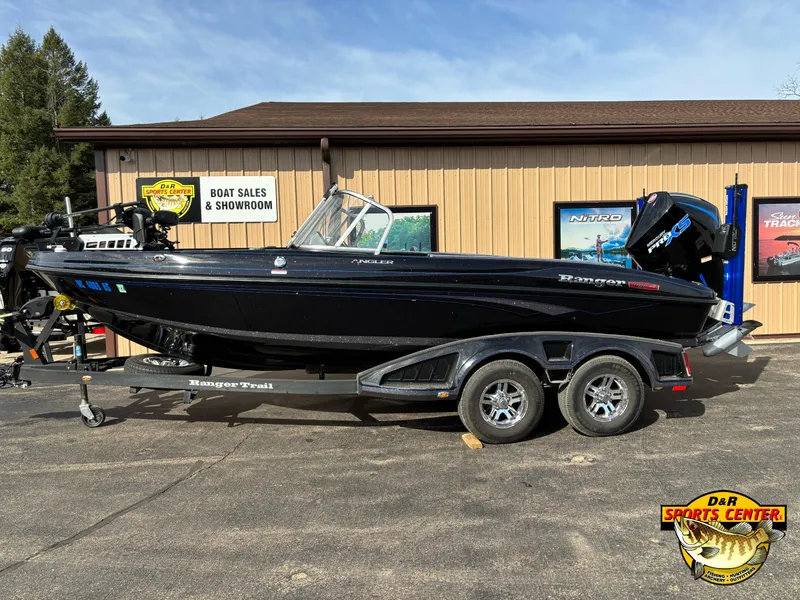Slide: The Image of 2021 Ranger 1880MS boat on trailer outside a boat sales showroom. - 1