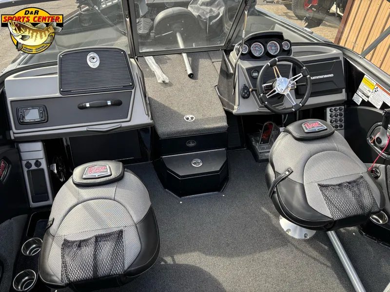 Slide: The Image of 2021 Ranger 1880MS boat interior with steering wheel, seats, and dashboard controls. - 6