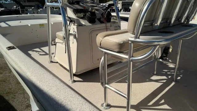 Slide: The Image of 2018 Carolina Skiff 238 DLV boat interior with seating and console. - 10