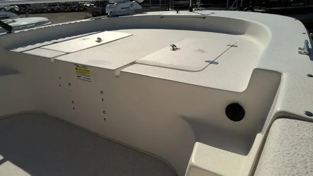 Slide: The Image of 2018 Carolina Skiff 238 DLV boat deck with storage compartments. - 3