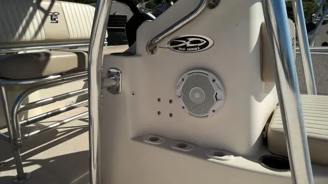 Slide: The Image of 2018 Carolina Skiff 238 DLV boat interior with speaker and seating. - 4