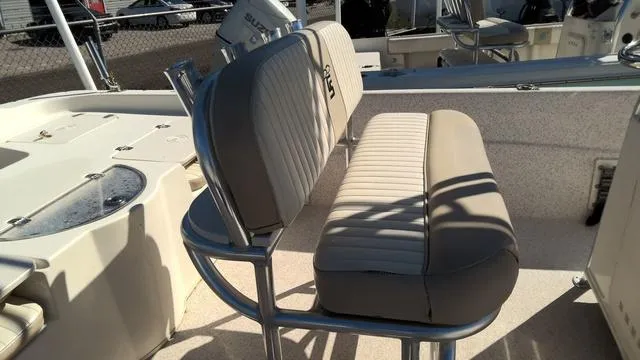 Slide: The Image of 2018 Carolina Skiff 238 DLV boat interior with cushioned seating and stainless steel frame. - 5