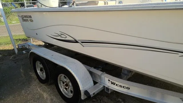 Slide: The Image of 2018 Carolina Skiff 238 DLV boat on Wesco trailer, side view. - 8