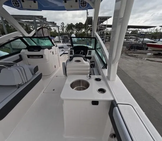 Slide: The Image of 2025 Robalo 257 Dual Console boat interior with seating and helm station. - 20