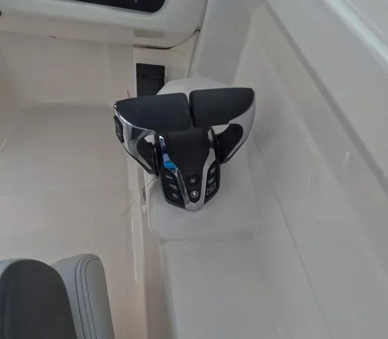 Slide: The Image of 2025 Robalo 257 Dual Console boat throttle control in sleek, modern design. - 28