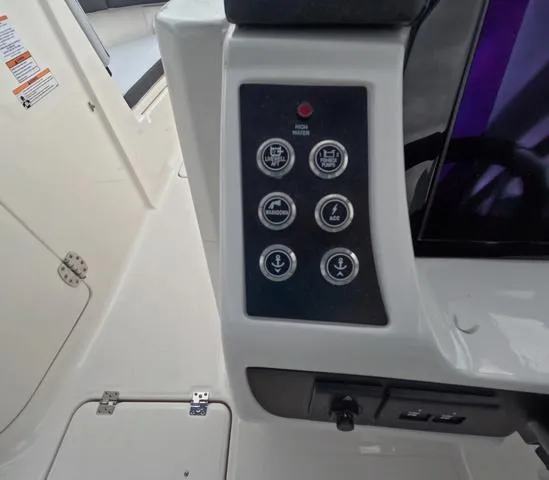 Slide: The Image of Control panel of 2025 Robalo 257 Dual Console boat with various function buttons. - 29