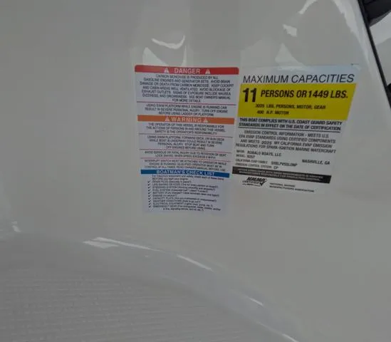 Slide: The Image of Capacity warning label on 2025 Robalo 257 Dual Console boat, maximum 11 persons or 1449 lbs. - 33