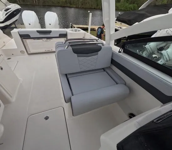 Slide: The Image of 2025 Robalo 257 Dual Console boat interior with sleek seating and modern design. - 37
