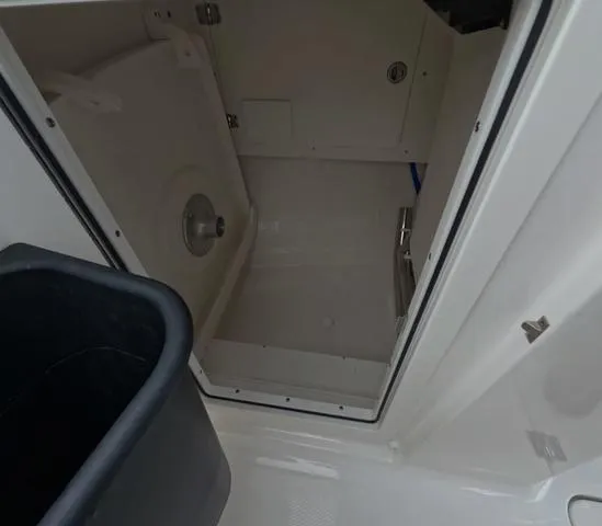Slide: The Image of Interior view of 2025 Robalo 257 Dual Console boat compartment. - 45