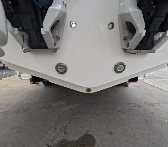 Slide: The Image of 2025 Robalo 257 Dual Console boat hull with dual engines, viewed from below. - 8