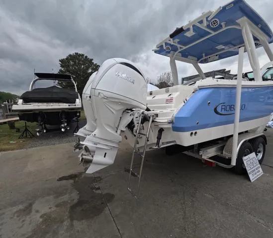 Slide: The Image of 2025 Robalo 257 Dual Console boat with Yamaha outboard motor on a trailer. - 9
