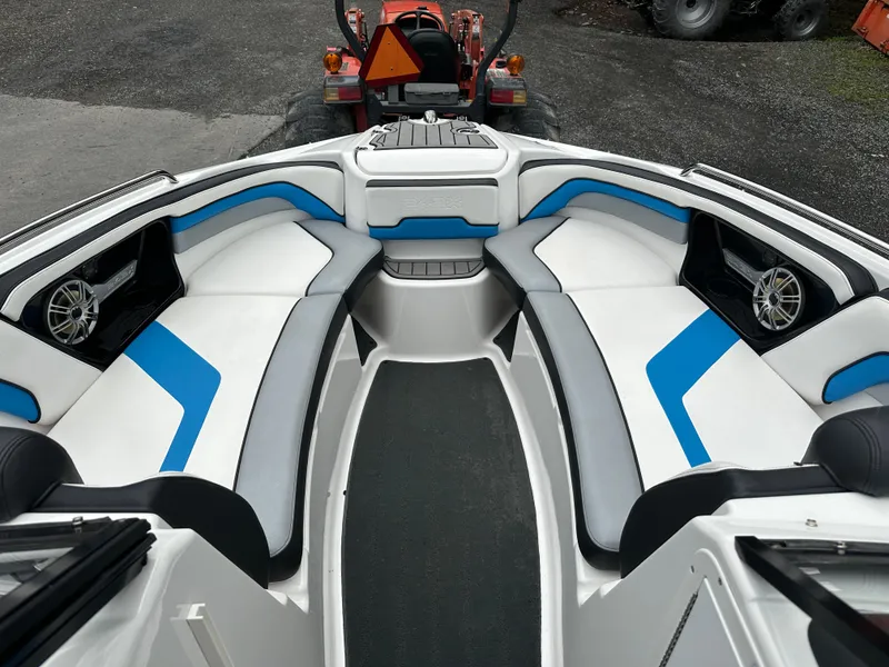 Slide: The Image of 2016 Yamaha Boats 242X E-Series interior with blue and white seating, showcasing modern design. - 19