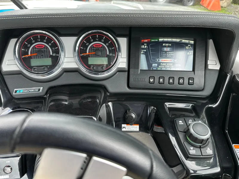 Slide: The Image of Dashboard of 2016 Yamaha Boats 242X E-Series with gauges and control panel. - 23