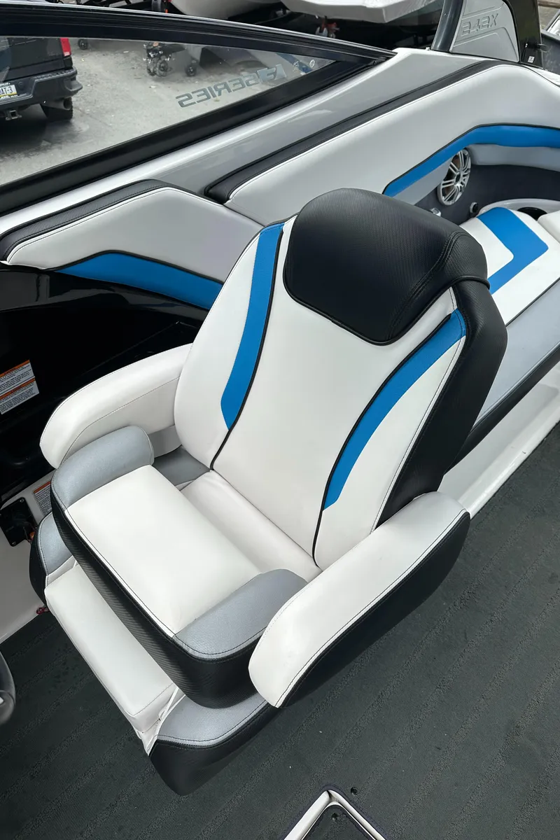 Slide: The Image of 2016 Yamaha Boats 242X E-Series interior with stylish blue and white seating. - 27