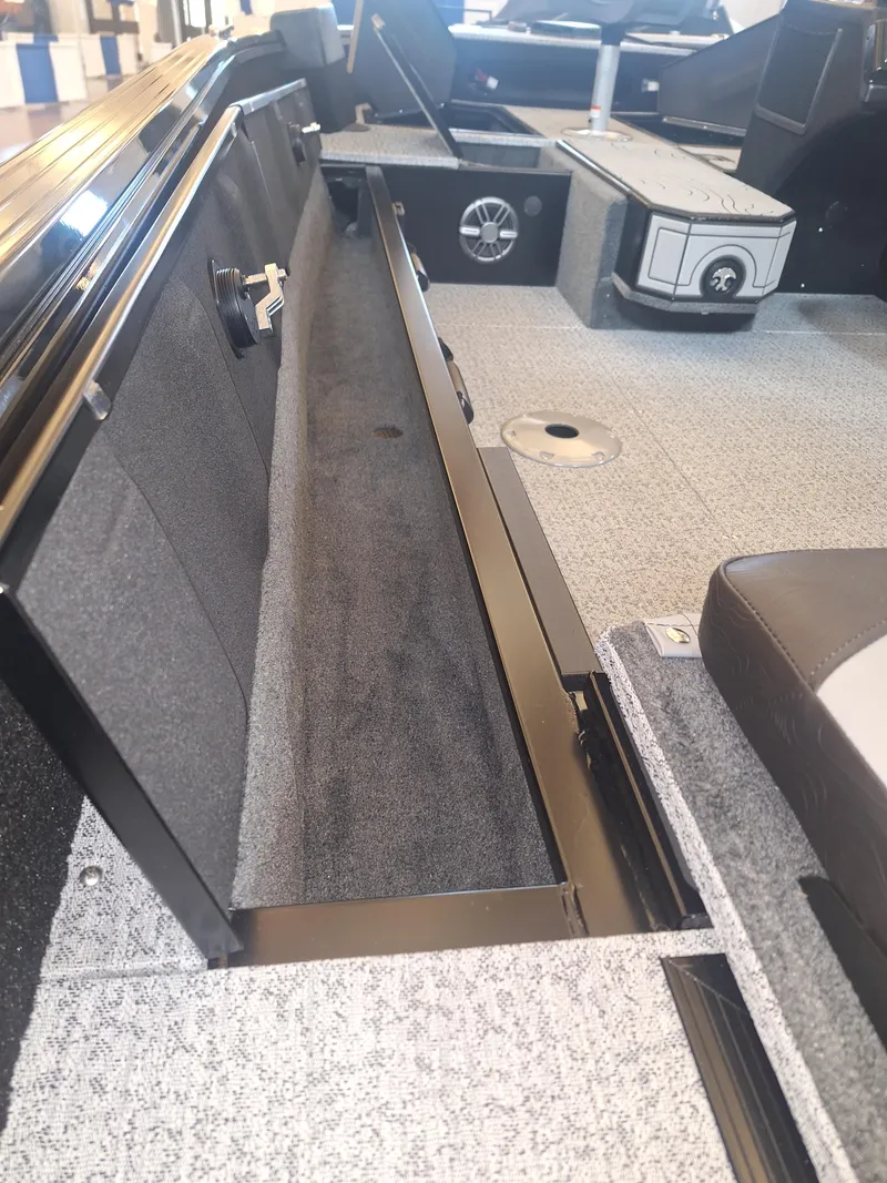 Slide: The Image of 2025 Smoker Craft Excursion 166 SC interior, featuring storage compartments and seating. - 3