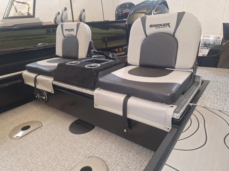 Slide: The Image of 2025 Smoker Craft Excursion 166 SC boat interior with dual seats and cup holders. - 5