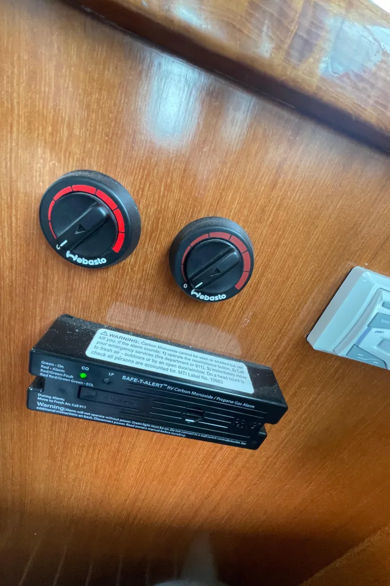 Slide: The Image of Control panel of a 2006 North Pacific 42 boat with Webasto dials. - 14