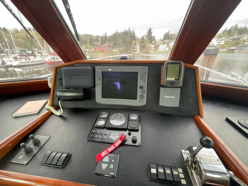Slide: The Image of Pilothouse of 2006 North Pacific 42 yacht with navigation equipment and controls. - 15