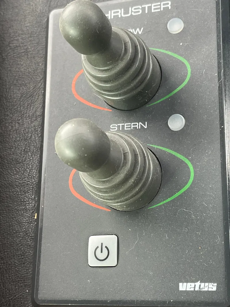 Slide: The Image of Control panel with bow and stern thruster joysticks on a 2006 North Pacific 42 boat. - 16
