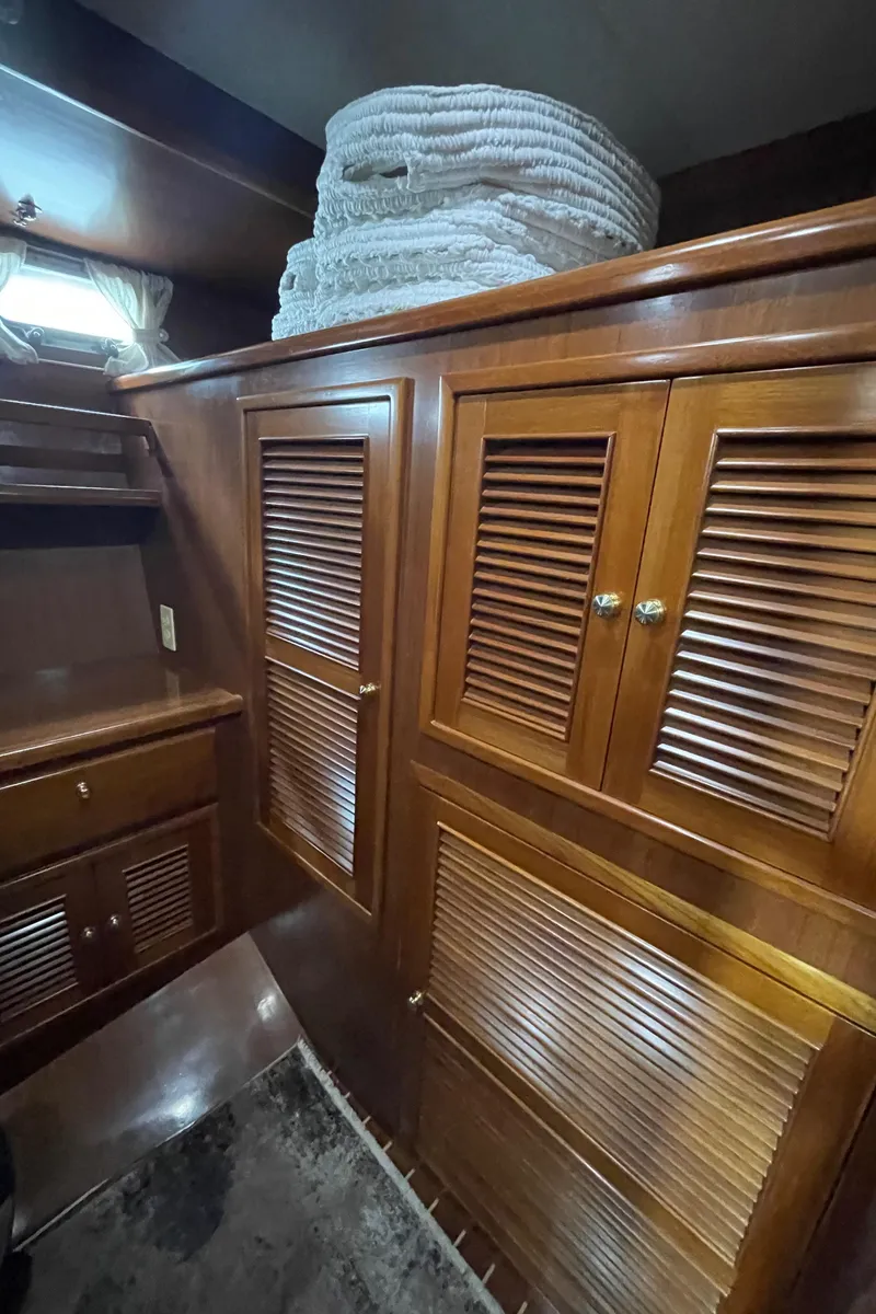 Slide: The Image of Interior of 2006 North Pacific 42 yacht with wooden cabinets and storage. - 33